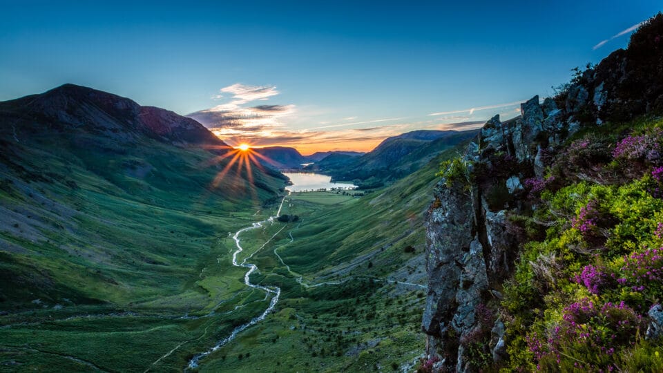 A View of The Sun Setting Over The Mountains in Buttermere, Lake District