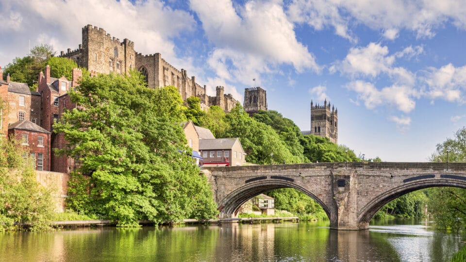 Durham Castle and Cathedral Perched on The Hill Overlooking The City, and Framwellgate Bridge Spanning The River Wear, England, UK